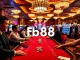 Players enjoying a thrilling game at FB68 casino tables filled with excitement and vibrant colors.
